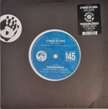 João Bosco / Antonio Adolfo E A Brazuca - O Ronco Da Cuíca / Transamazônica (7", Single, RE)