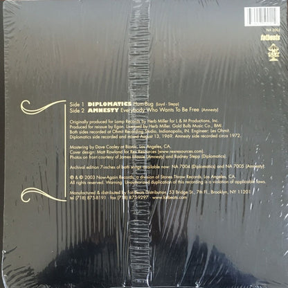 Diplomatics / Amnesty - Hum-Bug b/w Everybody Who Wants To Be Free (12", Single)