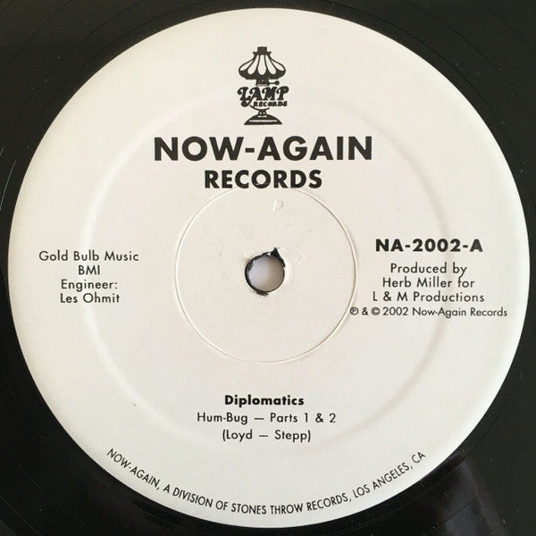 Diplomatics / Amnesty - Hum-Bug b/w Everybody Who Wants To Be Free (12", Single)
